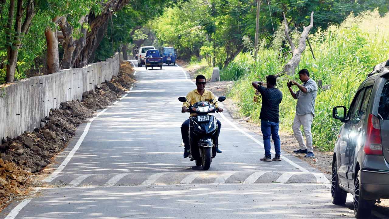 A motorist slows down as he approaches one of newly constructed speed breakers