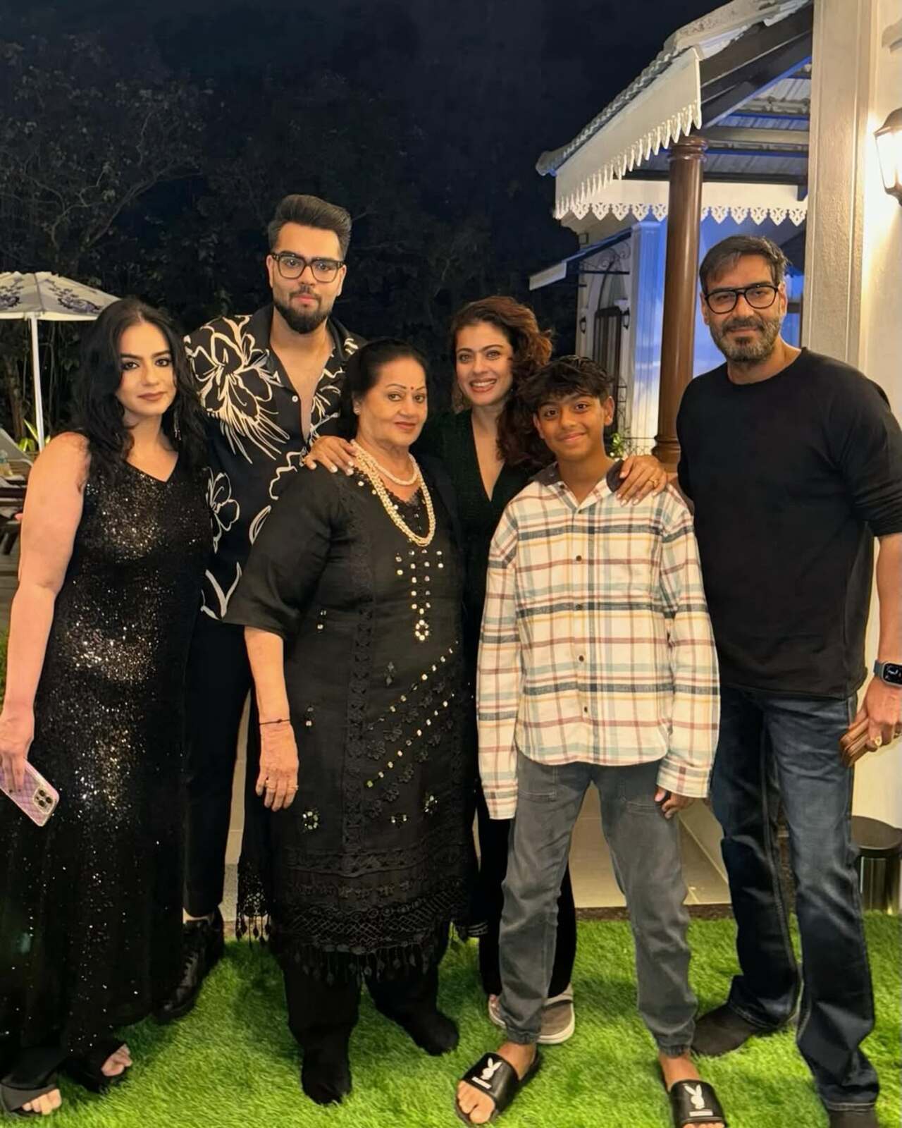 Another family portrait features the Devgn clan looking absolutely glamorous as they put their best fashion foot forward