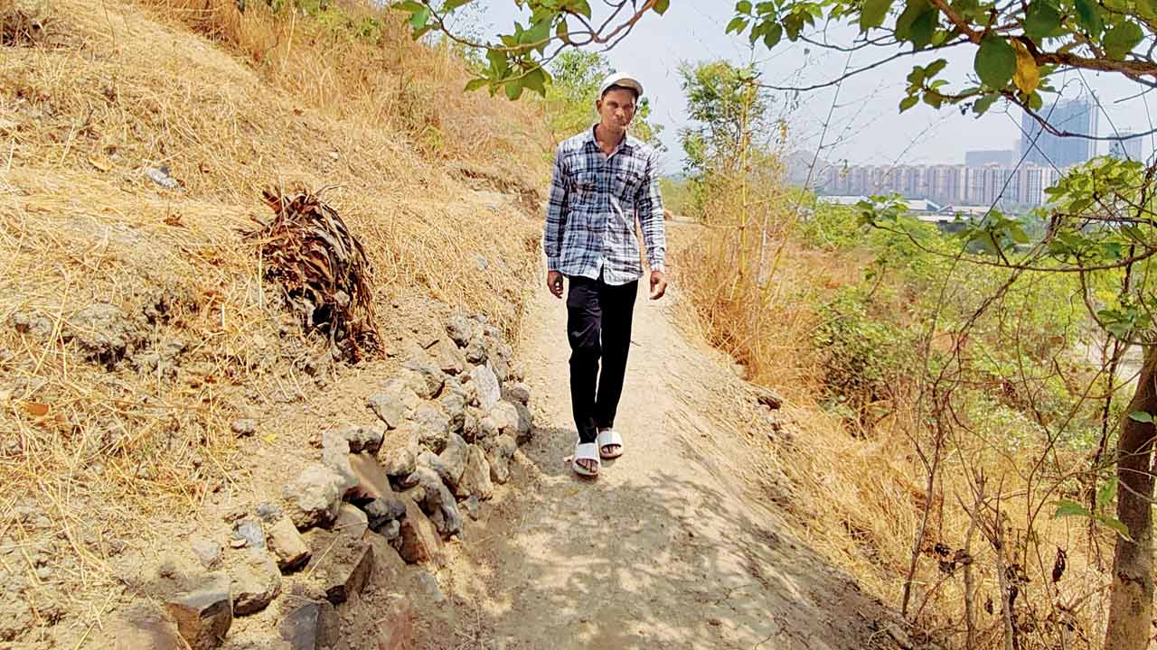 A team member walks on the designated trail before the birdwalk 
