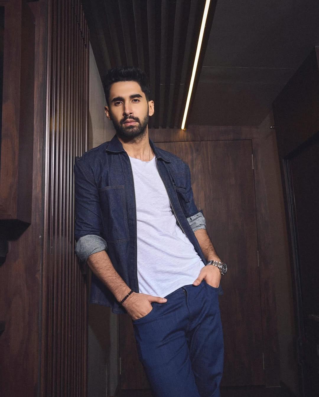 In this look, the actor wore a white T-shirt and paired it with a full-sleeved shirt and matching pants. He styled his look with white sneakers, and to further give his look charm, he folded the sleeves of his shirt and wore a wristwatch