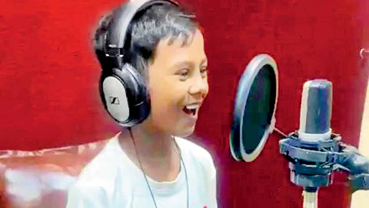 A child tries his hand at voice acting in the studio. PIC COURTESY/RICHARD JOEL