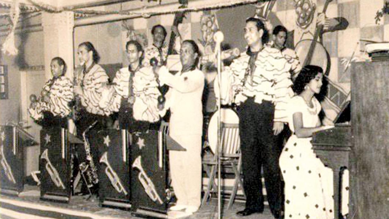 Chic Chocolate (second from right) and Lucilla Pacheco (on the piano) performing after the success of the film Albela 