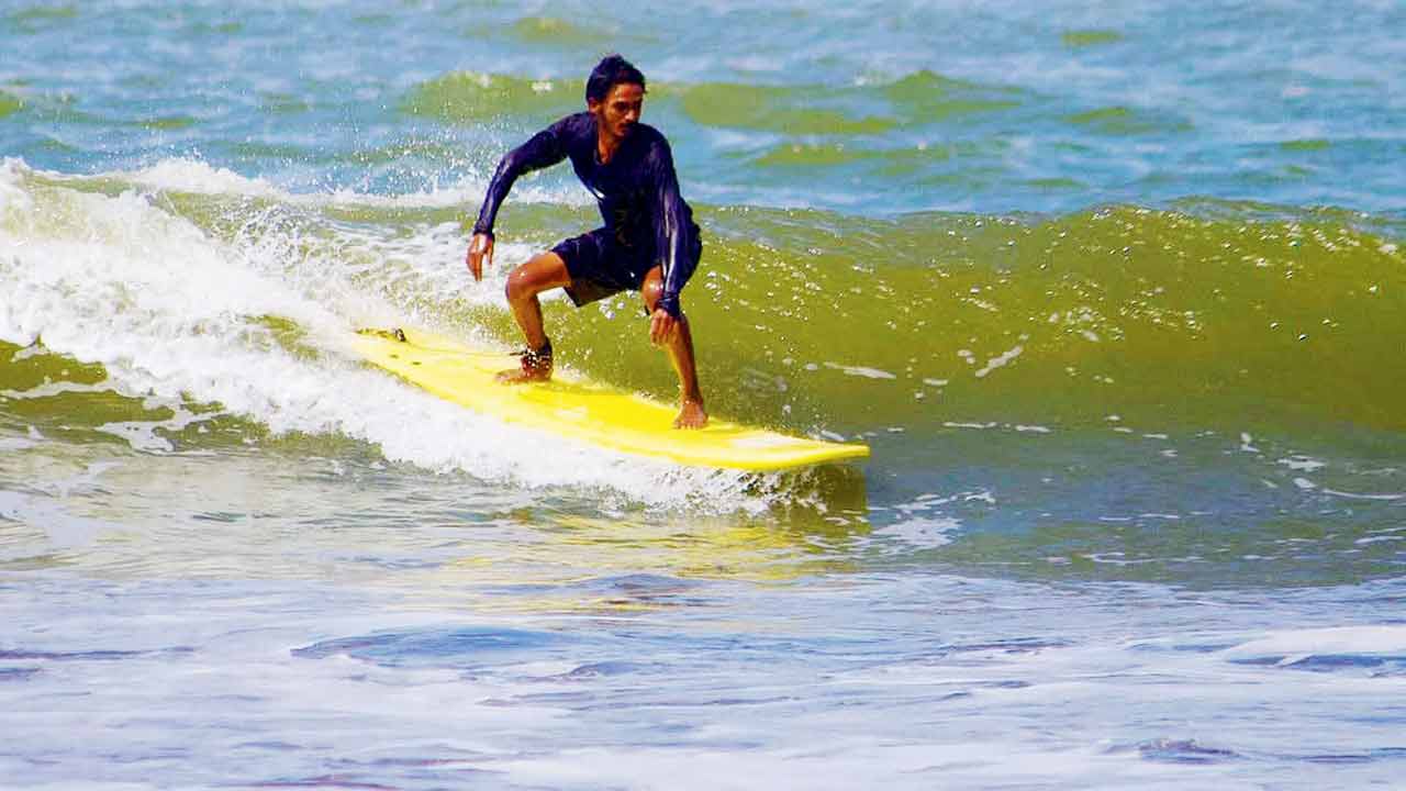 A surfer rides a wave in Virar. PIC COURTESY/MUMBAI SURF CLUB