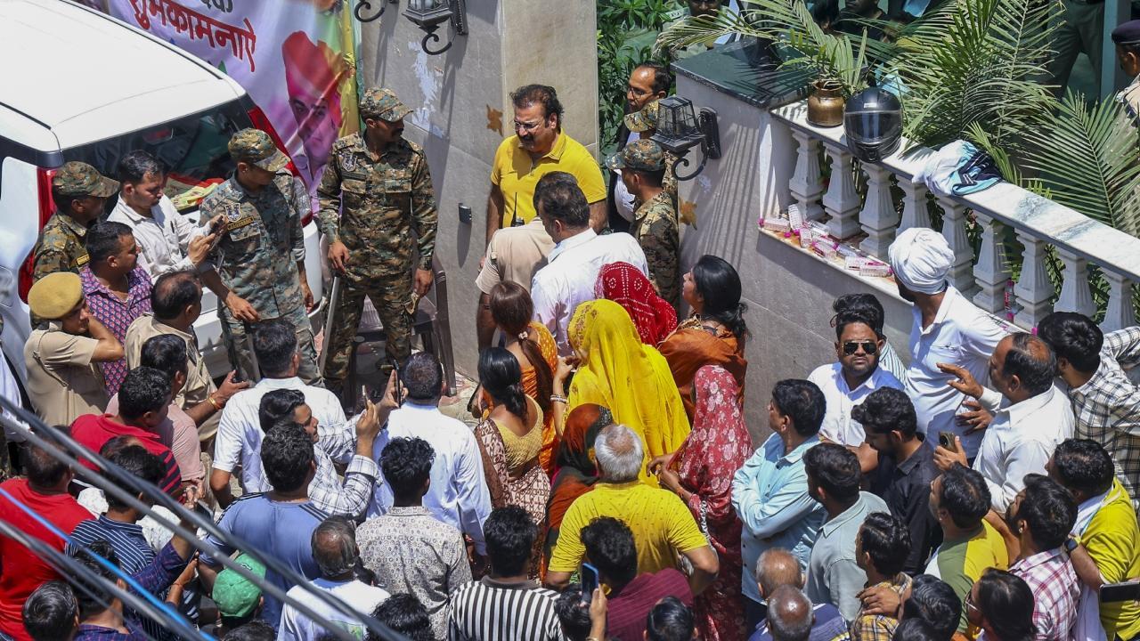 Pratap Singh Khachariyawas (in yellow) during the Enforcement Directorate's raid at his residence on Tuesday. Pics/PTI