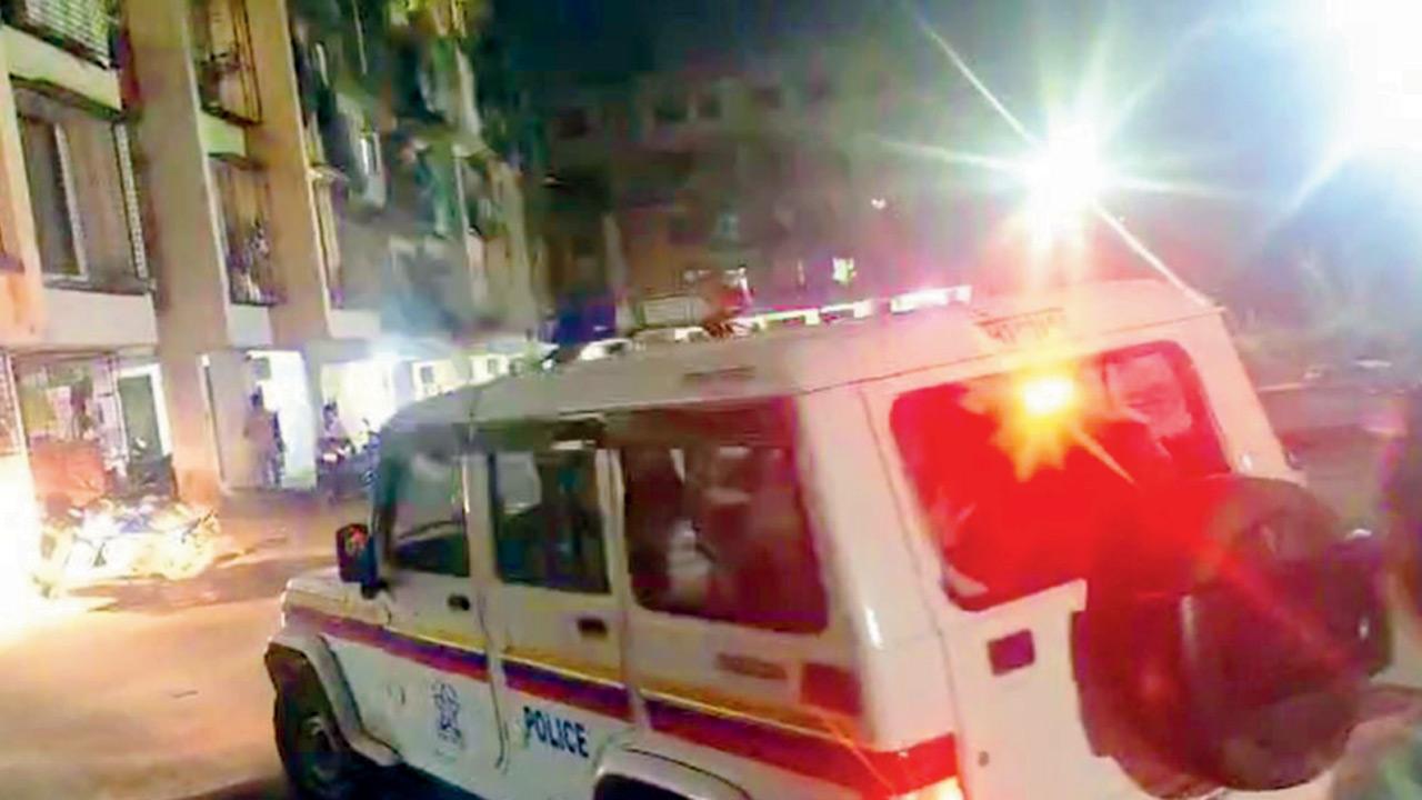 The police at the building after arresting the accused