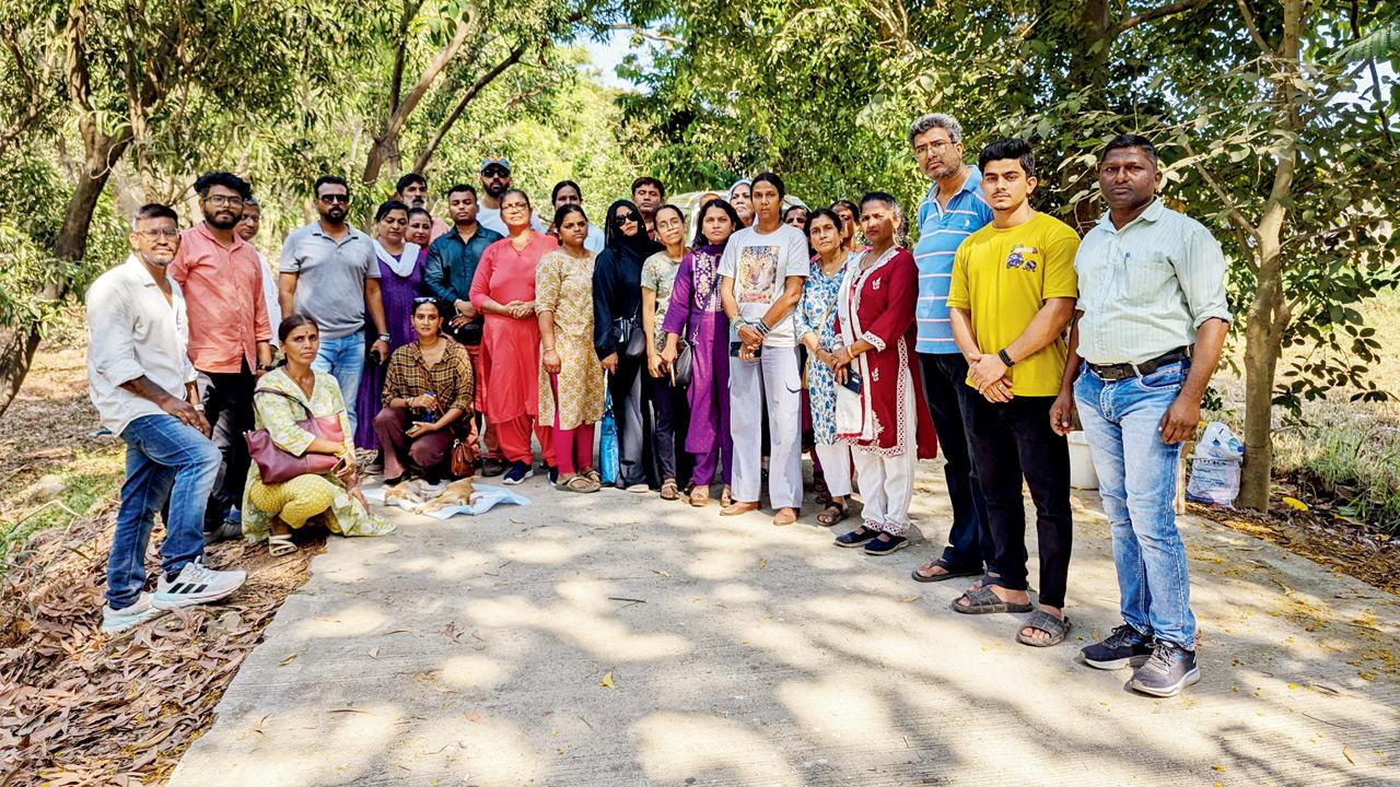 Animal lovers and the bodies of the two puppies that were likely killed by a wild animal. PICs/Ranjeet Jadhav