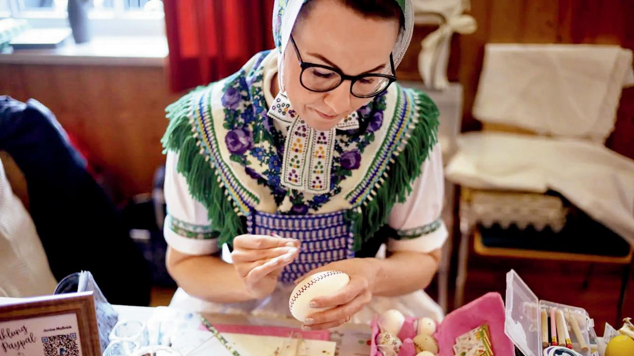 Janine Massnick decorates a traditional Sorbian Easter Egg