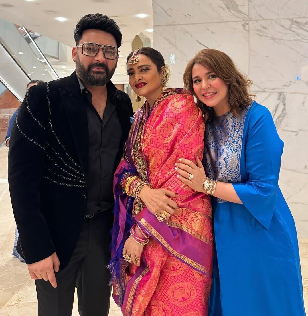 Another heartwarming moment—Kapil Sharma and his wife posing with the legendary Rekha