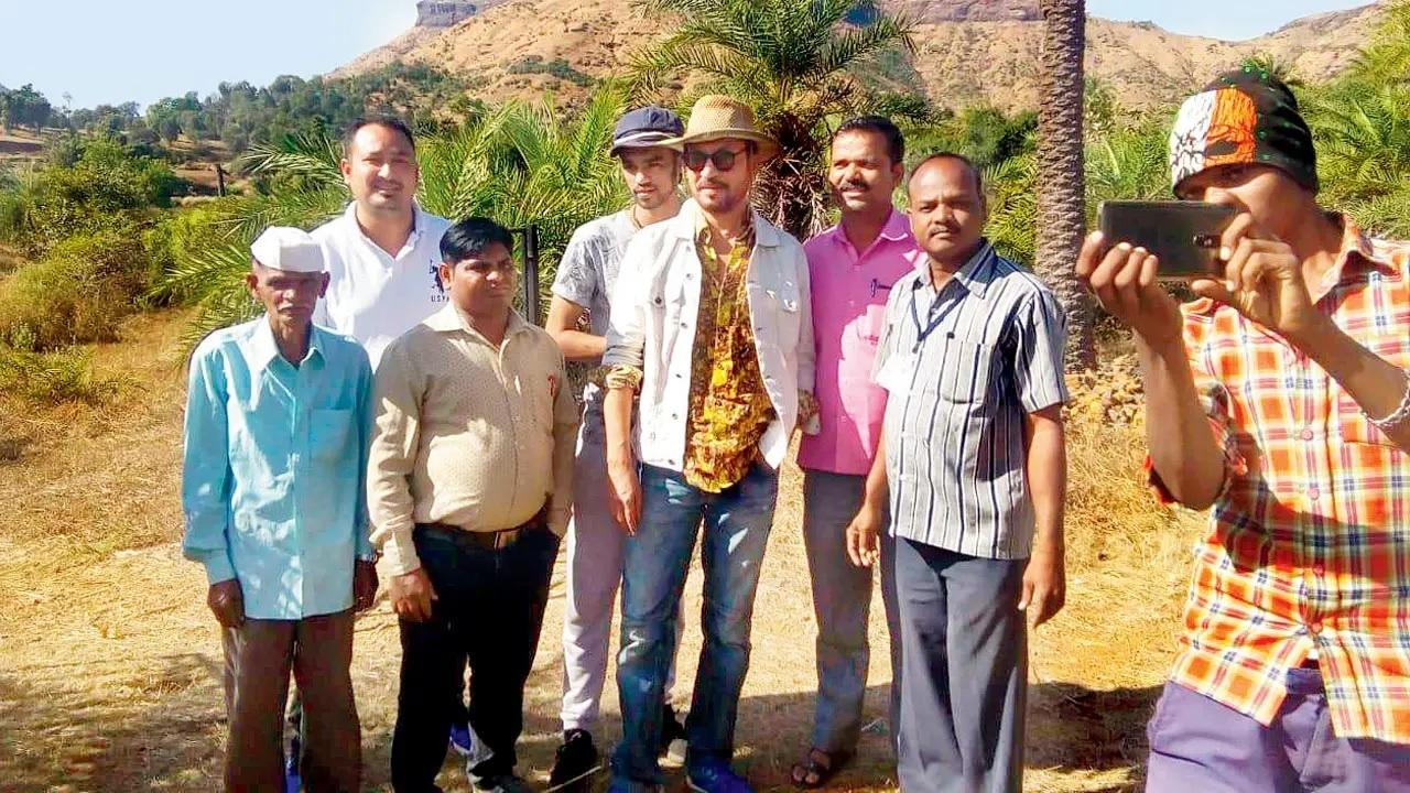 Though he never formally adopted the village, during his time here, Irrfan touched lives across all domains. In picture, Irrfan and Babil (fourth from left), along with people from the village during one of his visits to Hiruchiwadi. Pic/Special arrangement