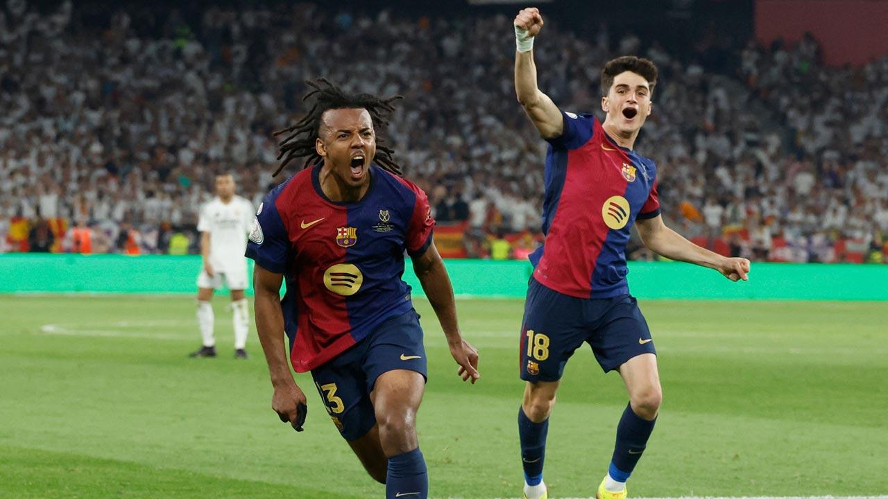 Barcelona`s French defender Jules Kounde (L) celebrates scoring his team`s third goal during their Spanish Cup, Copa del Rey (King`s Cup) final football match between FC Barcelona and Real Madrid CF at La Cartuja stadium in Seville. Pic/AFP