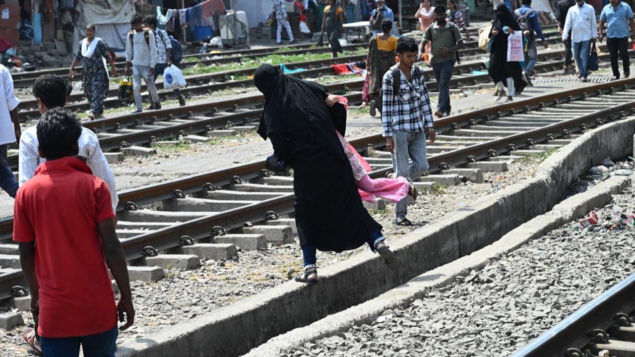 In Photos: Commuters cross tracks as Mahim FOB undergoes urgent repairs