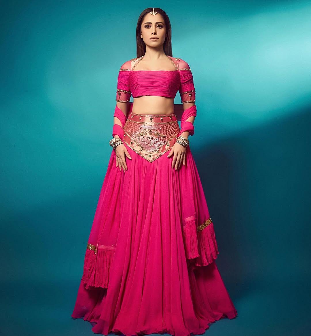 Nushrratt paired her outfit with multiple bangles and an intricately designed maang tikka. The actress wore minimal makeup to finish off her appearance