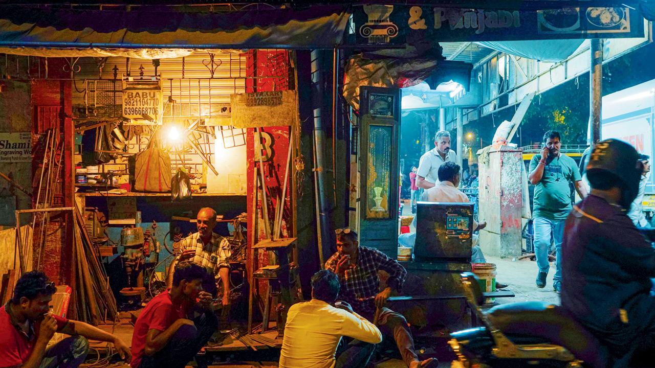 Workers at a metal fabrication workshop in Kamathipura