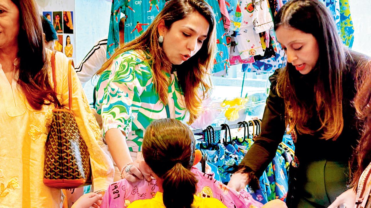 Children and parents shop during the event in Worli