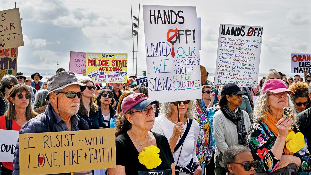 ‘Hands off!’ Protests against Trump administration take off across US