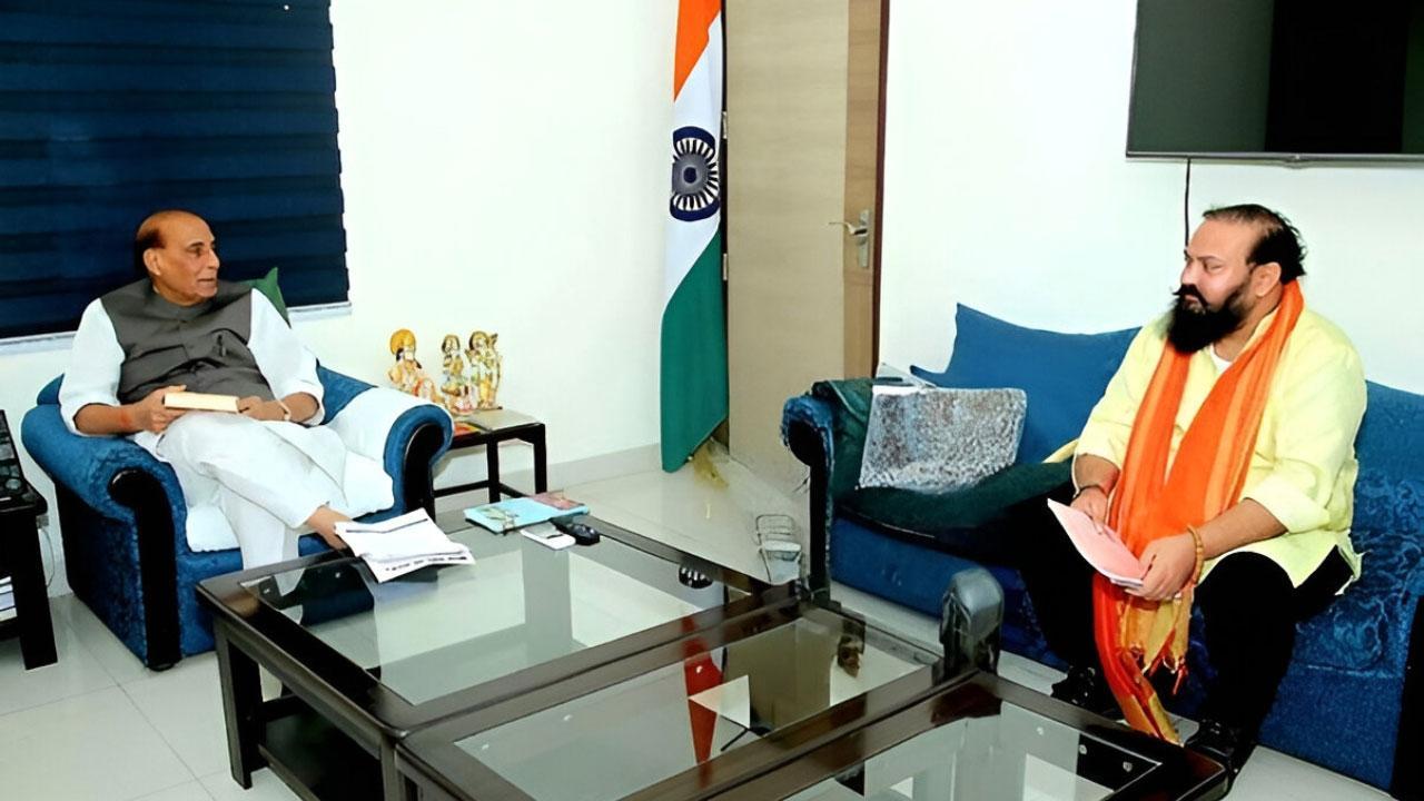 Wing Commander Pushkal Vijay Dwivedi (R) Meets Defence Minister Rajnath Singh