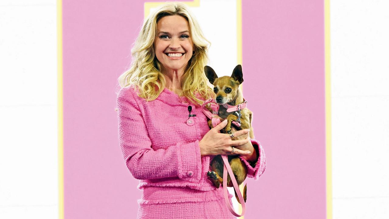 Reese Witherspoon in Elle Woods’s trademark colour pink