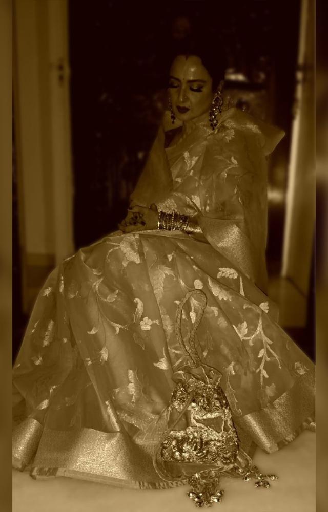 Radiating timeless elegance, she stunned in the richly crafted saree adorned with intricate gold and silver zari