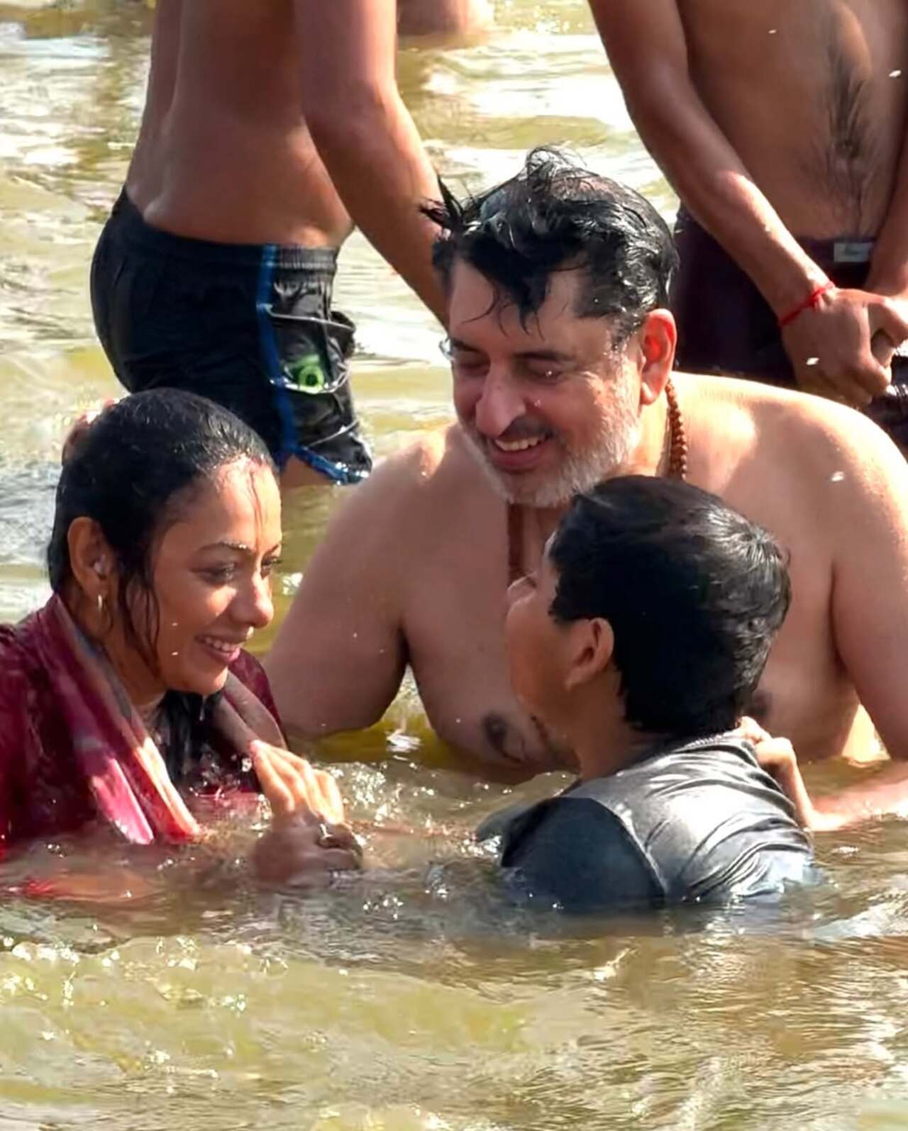 This picture has the three of them enjoying a happy dip at Triveni Sangam
