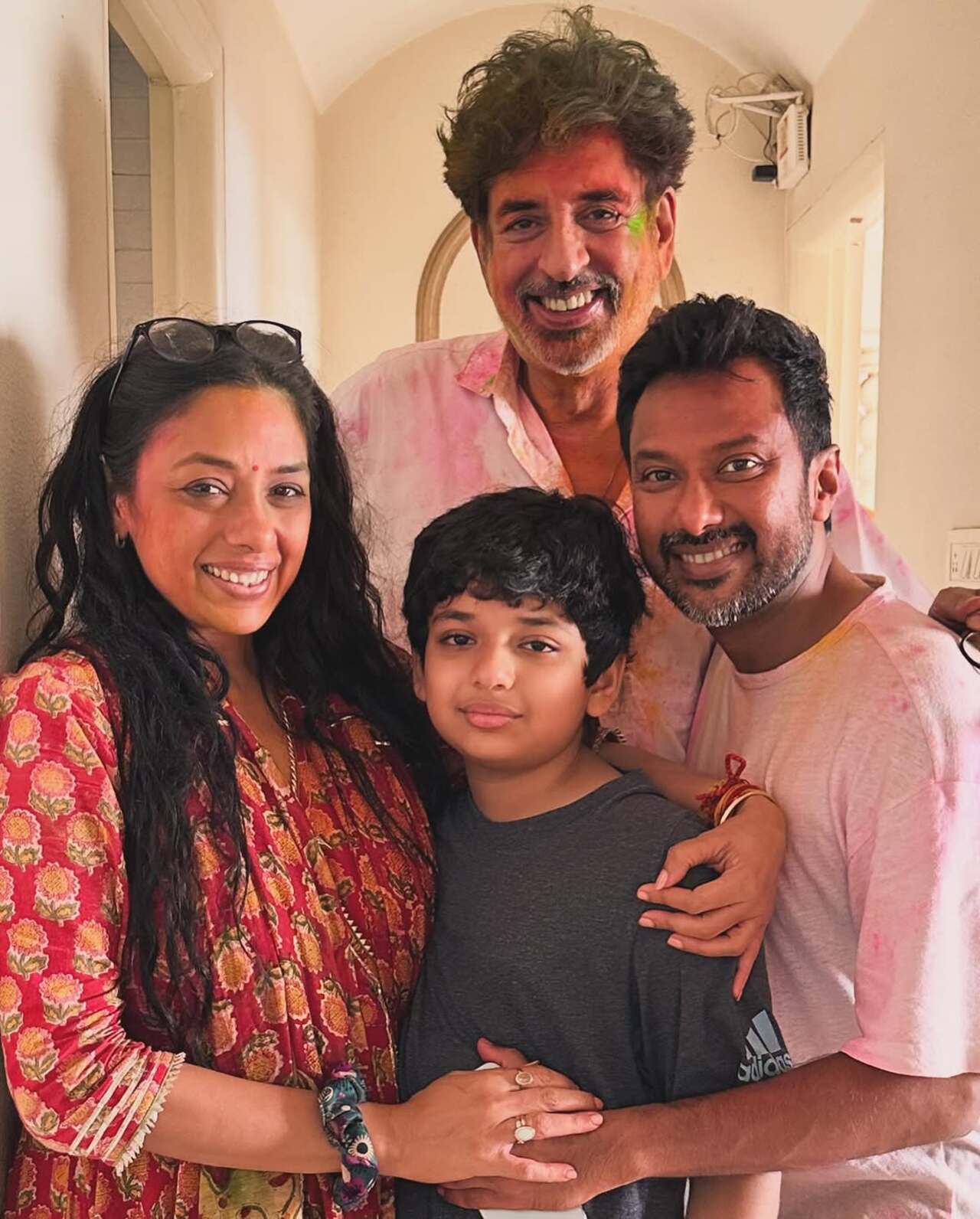 This snap has the family posing after enjoying a perfect Holi. The family looked cute, drenched in colour