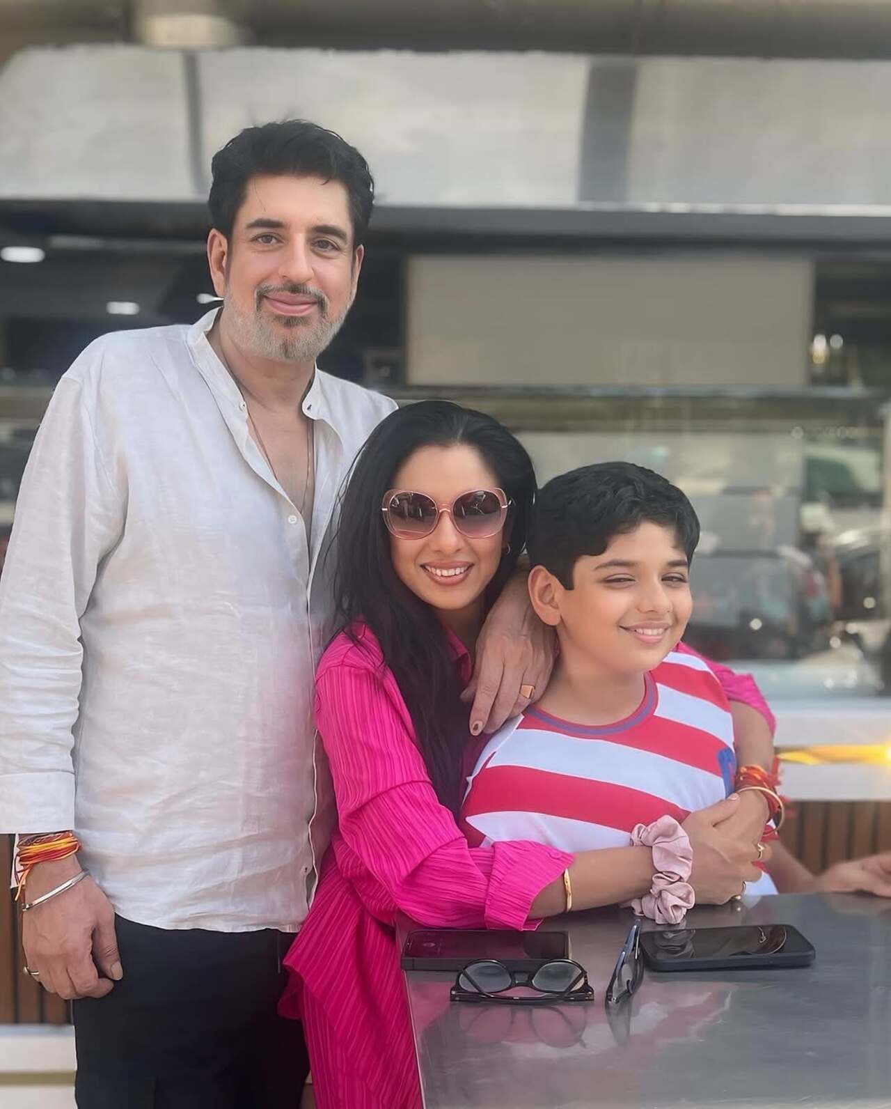A happy hug like no other! In this snap, Rupali Ganguly hugs her son from behind as the trio poses for a happy picture