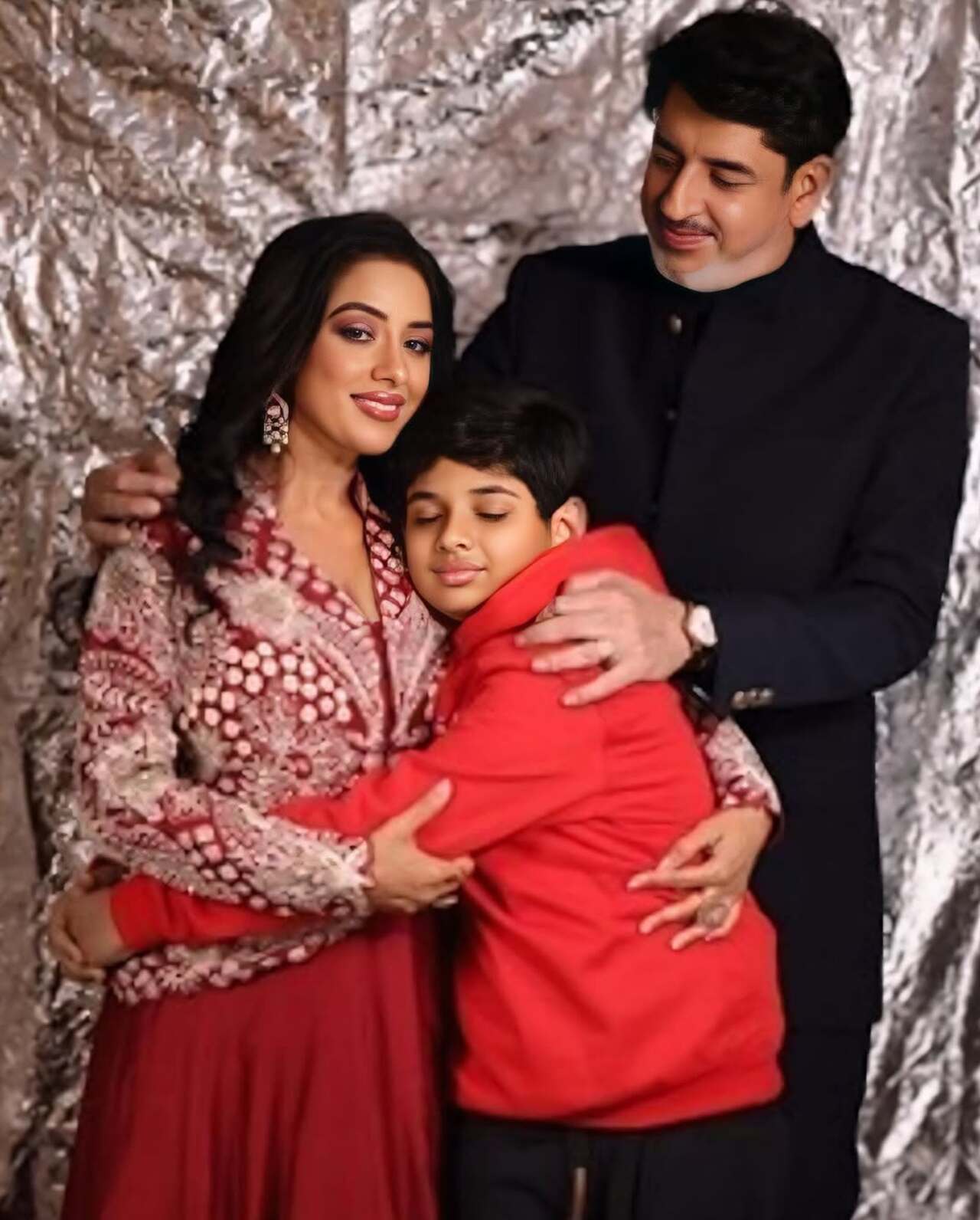 It's always about hugging your mom for peace. In this picture, Rudr hugs his mom Rupali as Ashwin looks at them with love