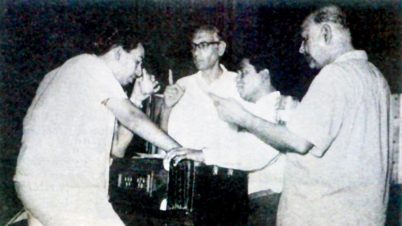 Rhys’ grandfather, Sebastian Dsouza (first from right) working on a tune in the studio
