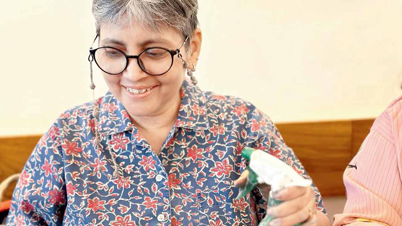 an adult participant works with clay