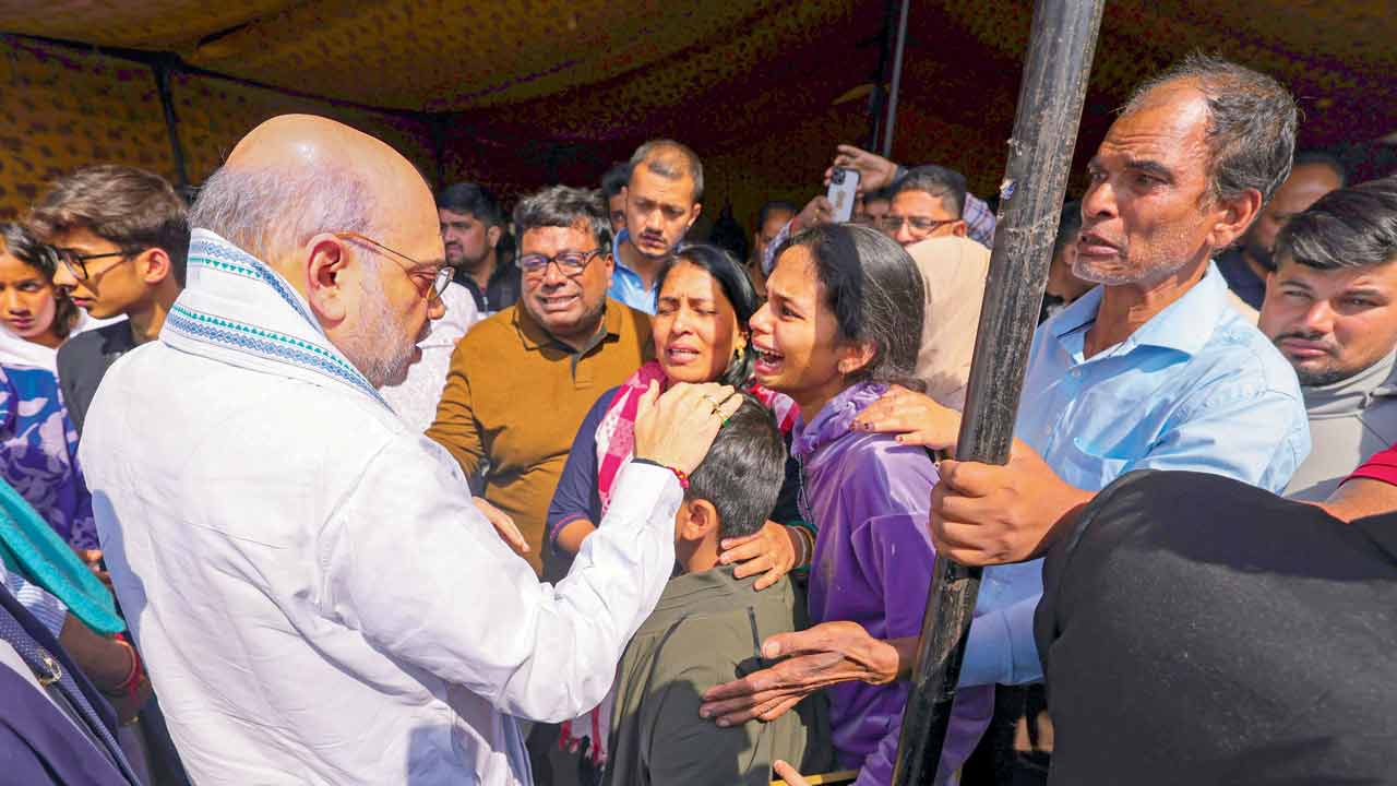 Union Home Minister Amit Shah meets family members of 26 people killed in the terror attack. Pic/PTI