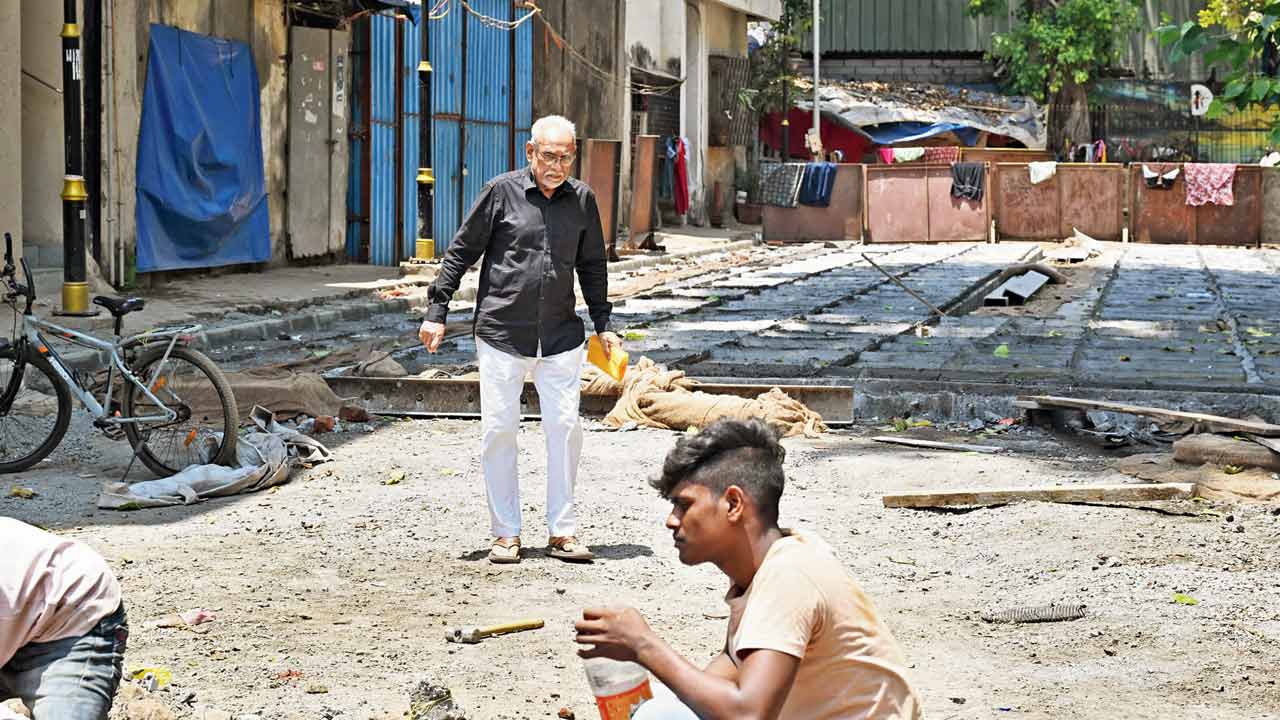 A senior citizen walks on the under-construction 1st Pasta Lane, Colaba, Mumbai, on April 11