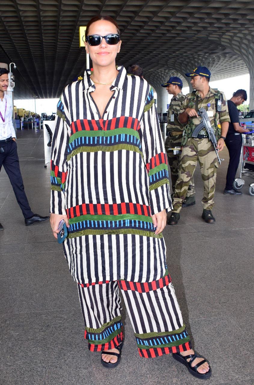 Neha Dhupia was snapped looking quite classy in her interesting airport outfit. She wore a comfy co-ord set, tied her hair back in a chic bun, and wore stylish sunglasses