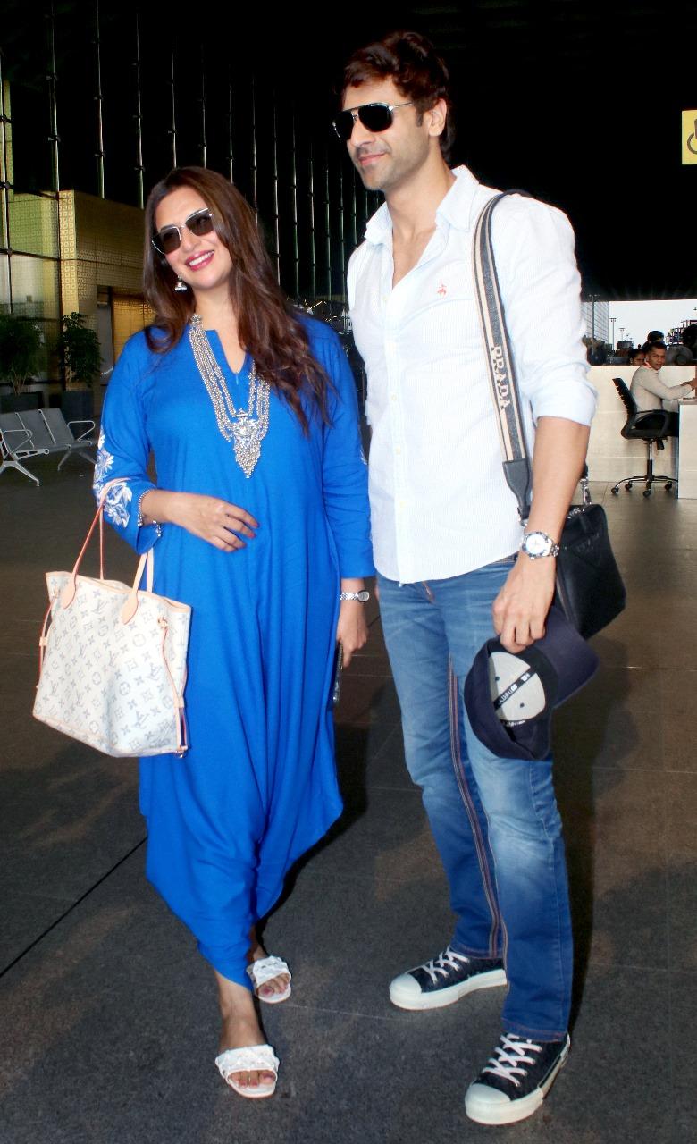 Divyanka Tripathi and Vivek Dahiya were snapped at Mumbai airport as they returned to the city