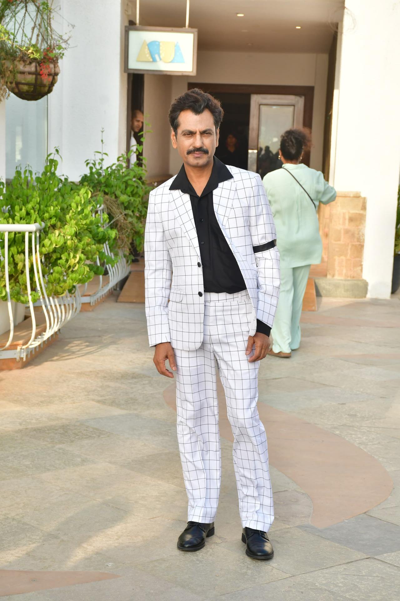 Nawazuddin Siddiqui looked smart in a white checkered suit set. He paired the suit with a black shirt as he was snapped at Sun-n-Sand hotel