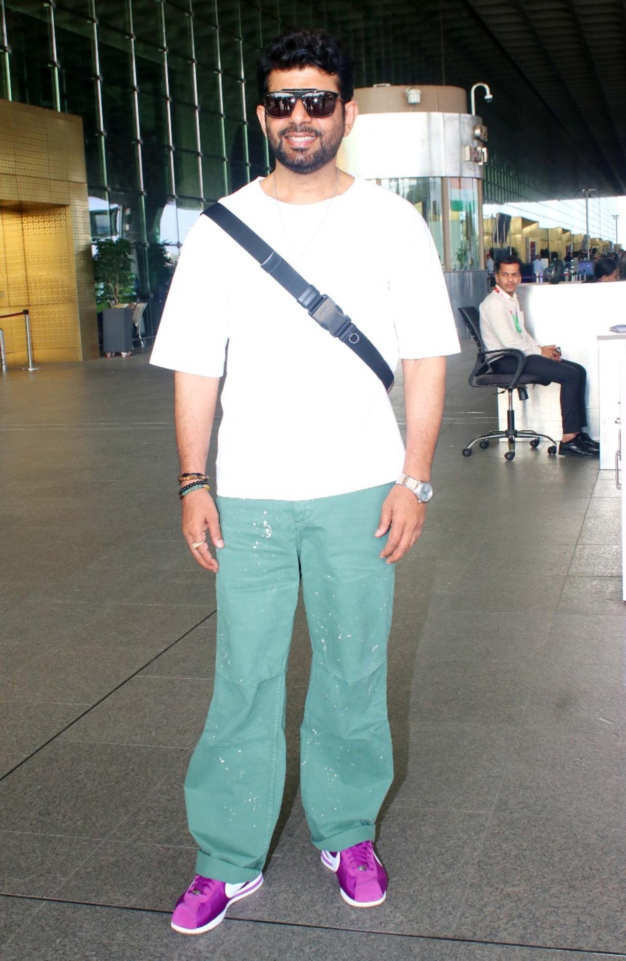 The actor looked smart in his colourful outfit. He wore a white T-shirt paired with green pants, but what stole the show was his purple footwear.