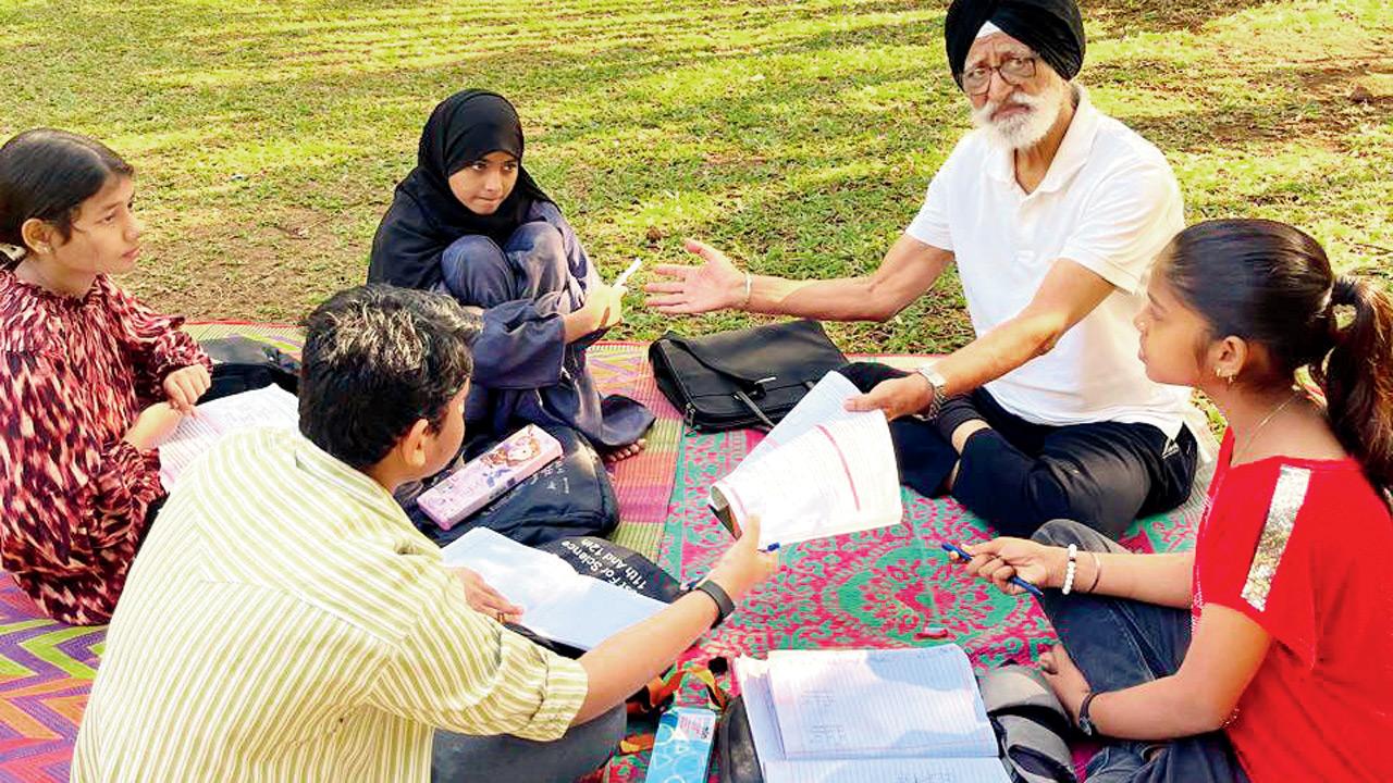 Children learn from a senior in  Andheri. PIC COURTESY/MONA ROHERA