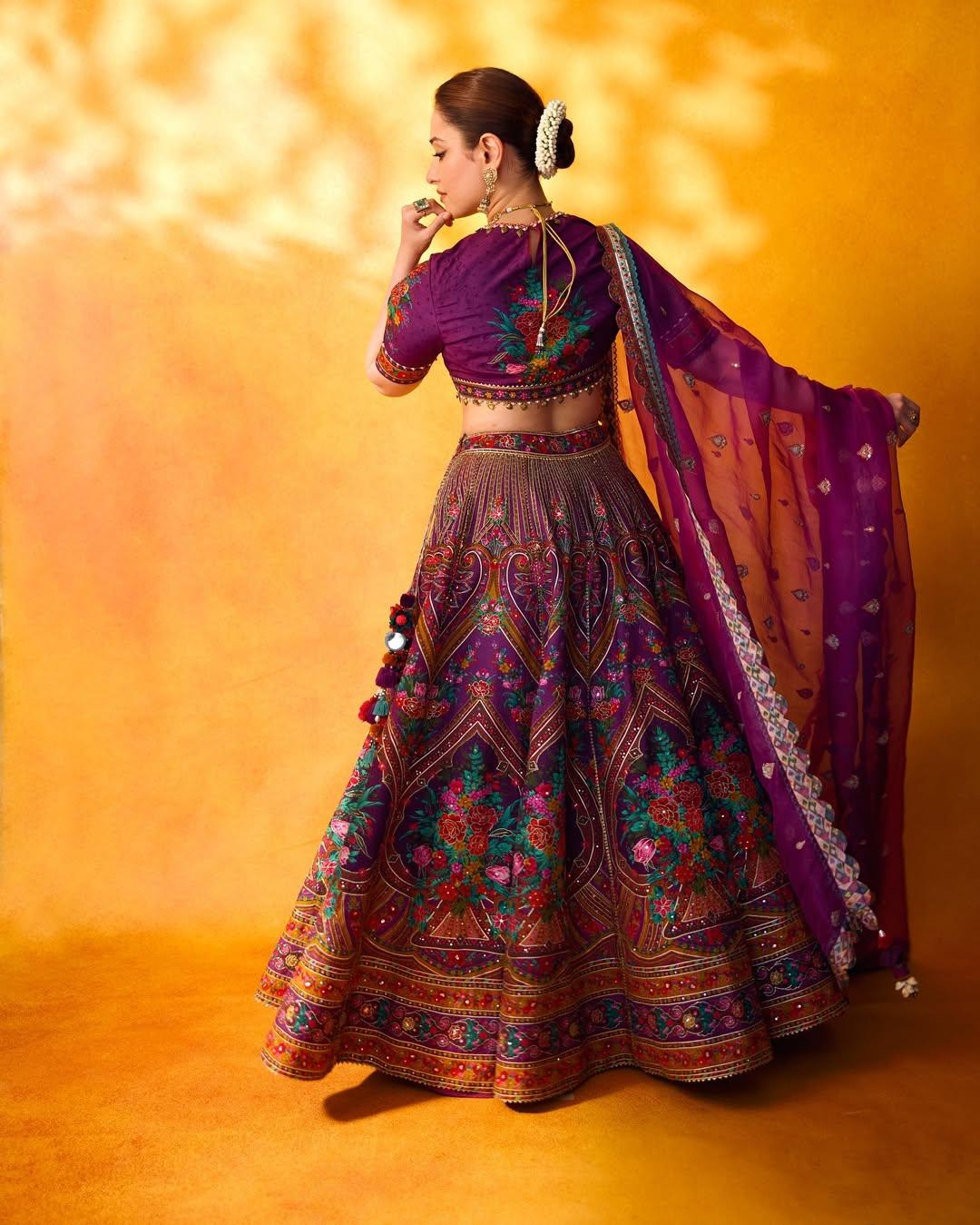 In this look, the actress wore a stunning embroidered purple blouse and paired it with a matching heavy lehenga and a sheer dupatta