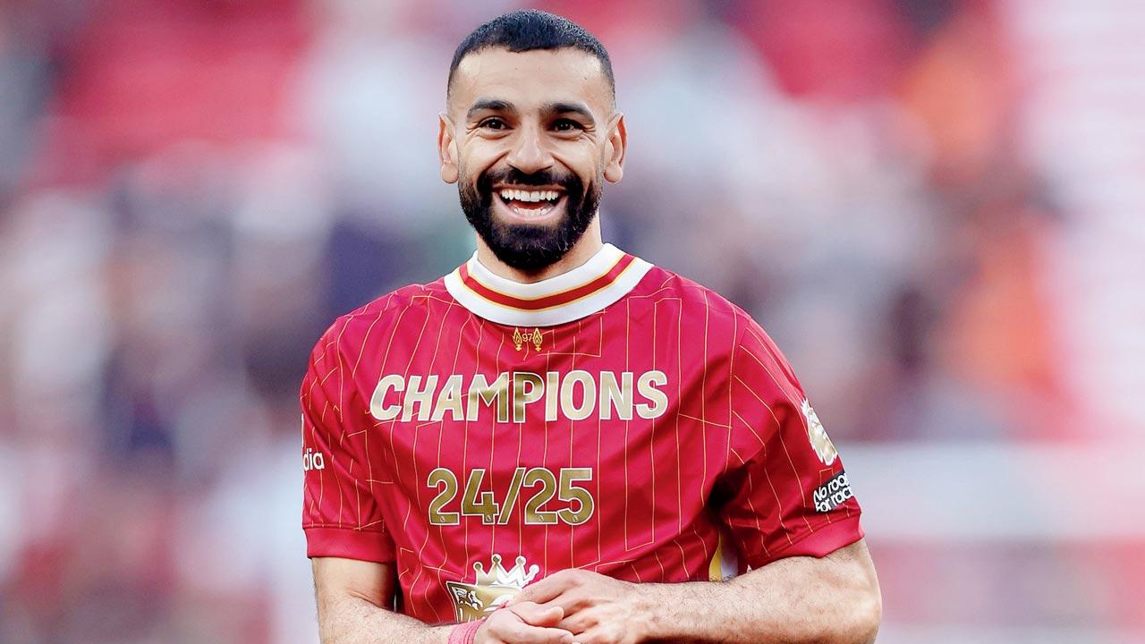 Liverpool striker Mohamed Salah is all smiles after their title triumph