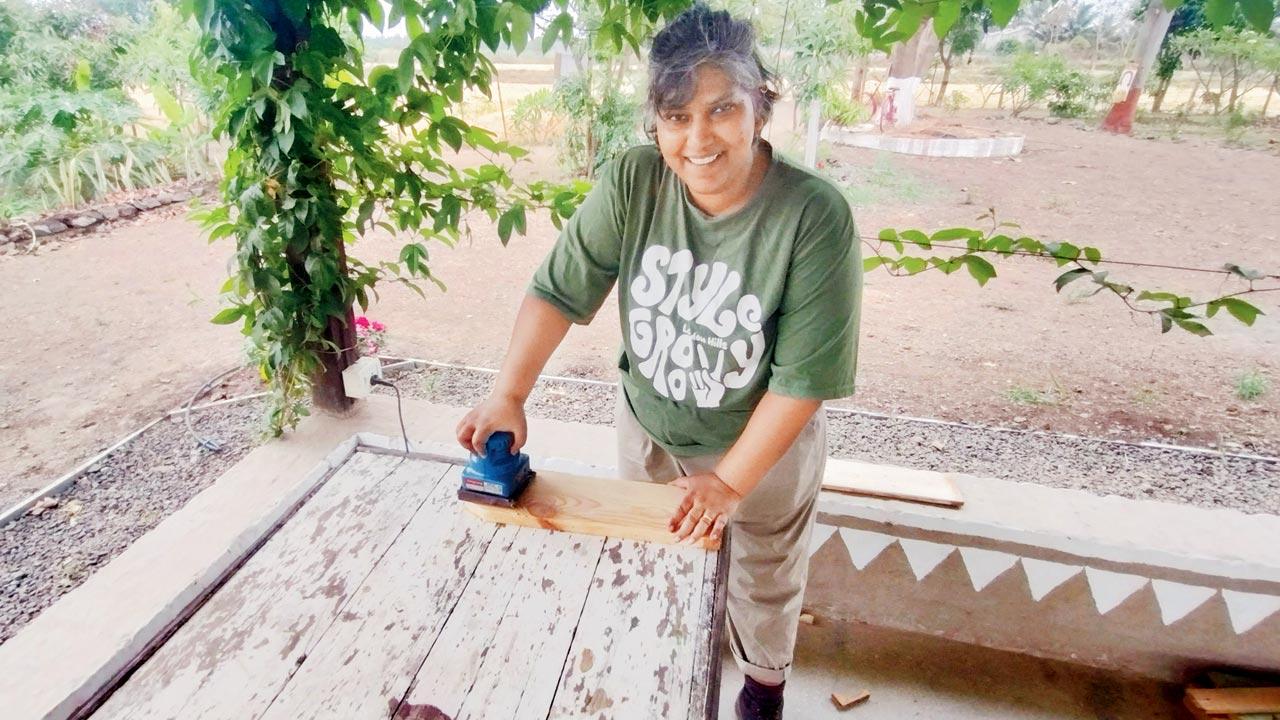 Yours truly sanding some wood to smoothen it out 