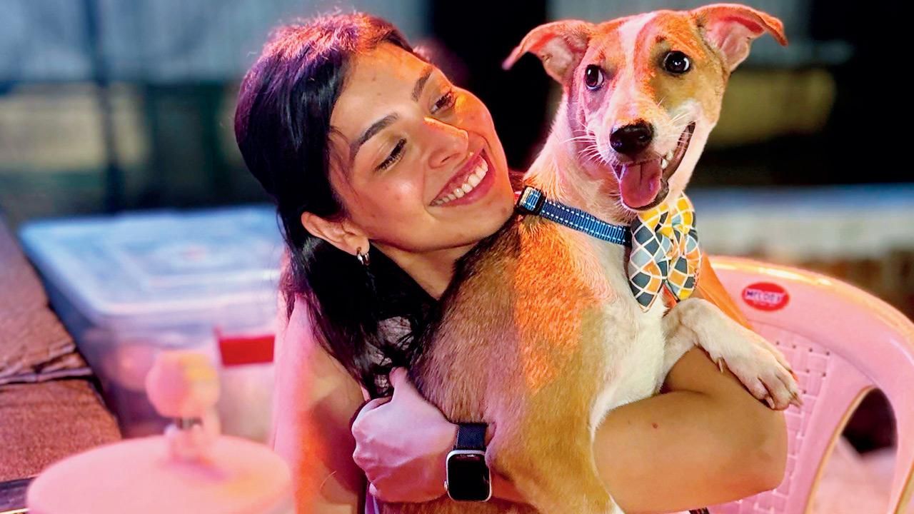 A participant cuddles a dog during the event. Pic courtesy/Yoda