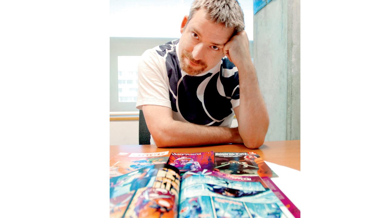 Jim Zub with his comics
