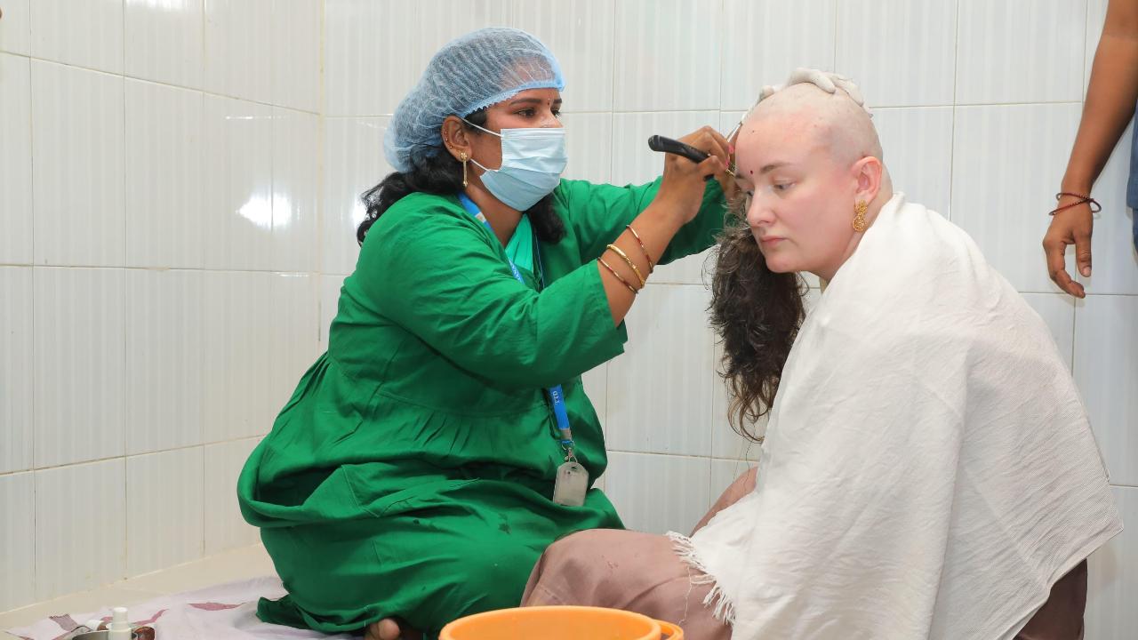 Pawan Kalyan’s wife Anna Lezhneva donates hair in Tirumala temple after son Mark’s safe return post fire accident. Read more