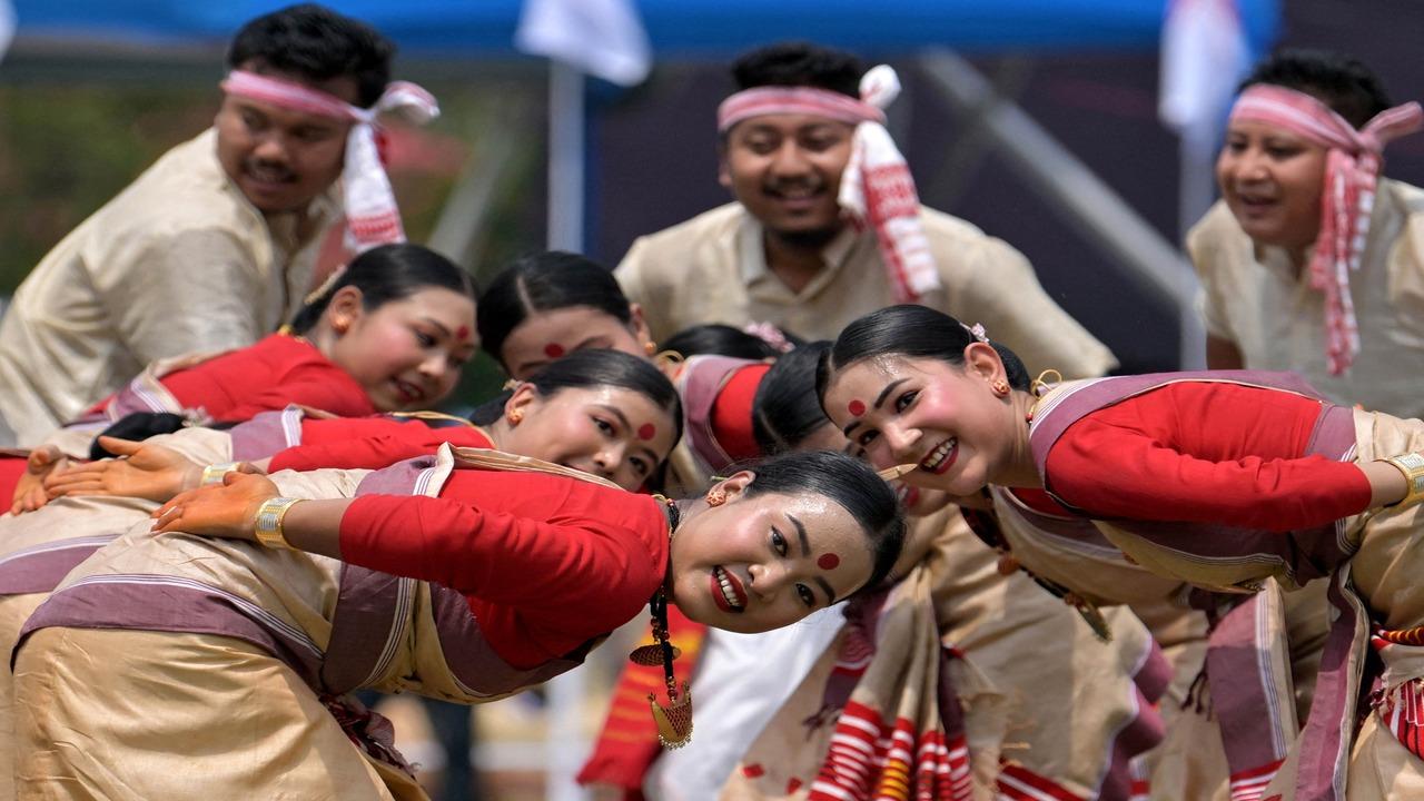 Youth perform traditional Bihu dance on the eve of the Bohag Bihu festival (Assamese New Year) in Guwahati on April 14, 2025. (AFP)