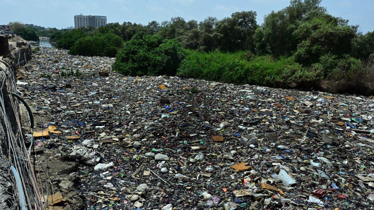 IN PHOTOS: Garbage floods nullah at Mumbai`s Dharavi, chokes its passage