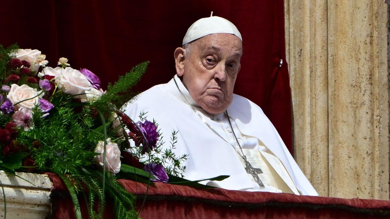 Pope Francis blesses the crowd from the main balcony of St Peter’s Basilica during the Urbi et Orbi message and blessing to the city and the world, as part of Easter celebrations at St Peter’s Square in the Vatican