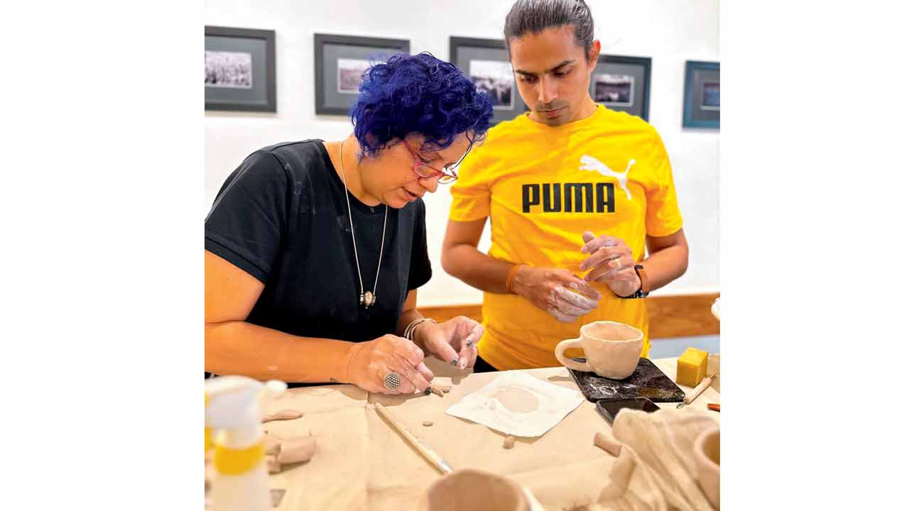 Garima Sharma (left) sculpts at a previous workshop