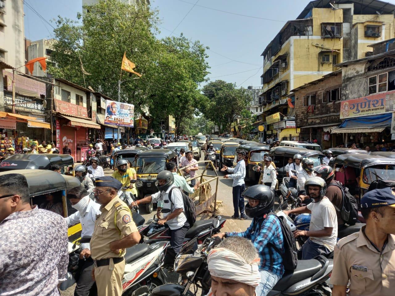 Police divert traffic even as commuters try to catch a glimpse of the enactment