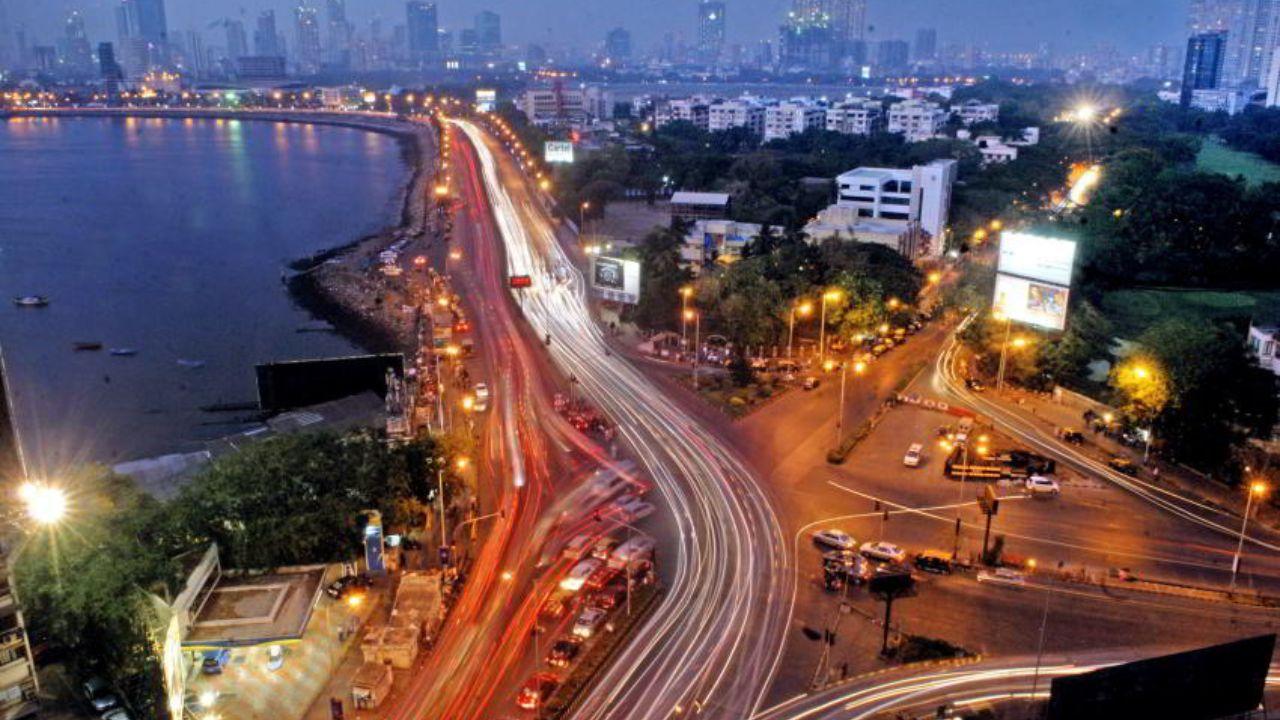 A bird’s-eye perspective of the Haji Ali Circle, framed with city lights and coastal charm