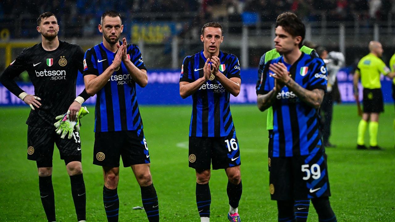 Inter Milan’s Spanish goalkeeper Josep Martinez Inter Milan’s Dutch defender Stefan de Vrij, Inter Milan`s Italian midfielder Davide Frattesi and Inter Milan`s Polish defender Nicola Zalewski react after AC Milan`s win at the end of the Coppa Italia second leg semi-final football match between Inter Milan and AC Milan at the San Siro stadium in Milan. Pic/AFP