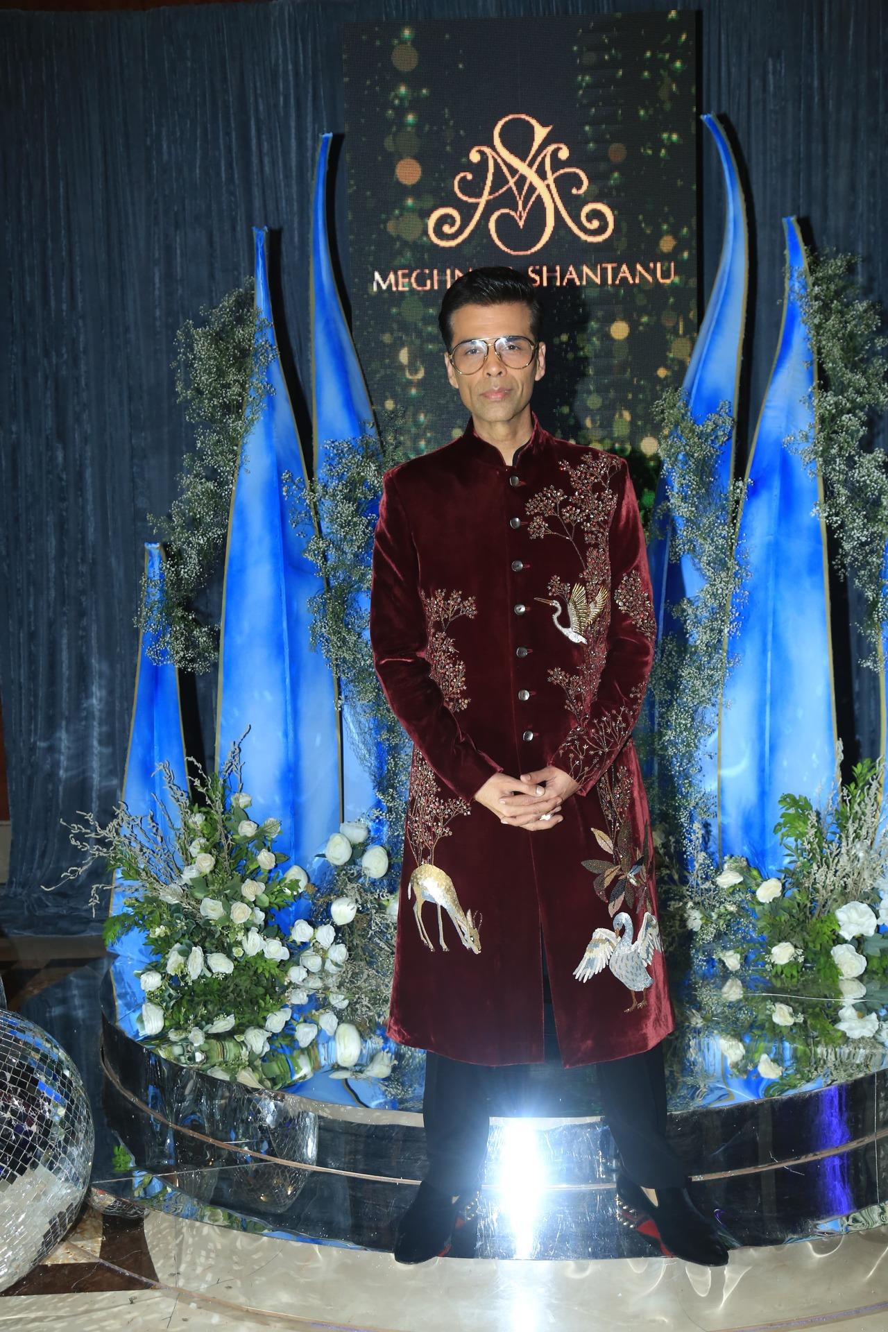 Karan Johar arrived in a maroon traditional outfit for the sangeet night