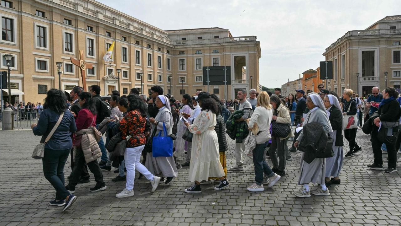 Faithful and pilgrims gather at St Peter's square after Pope Francis' death